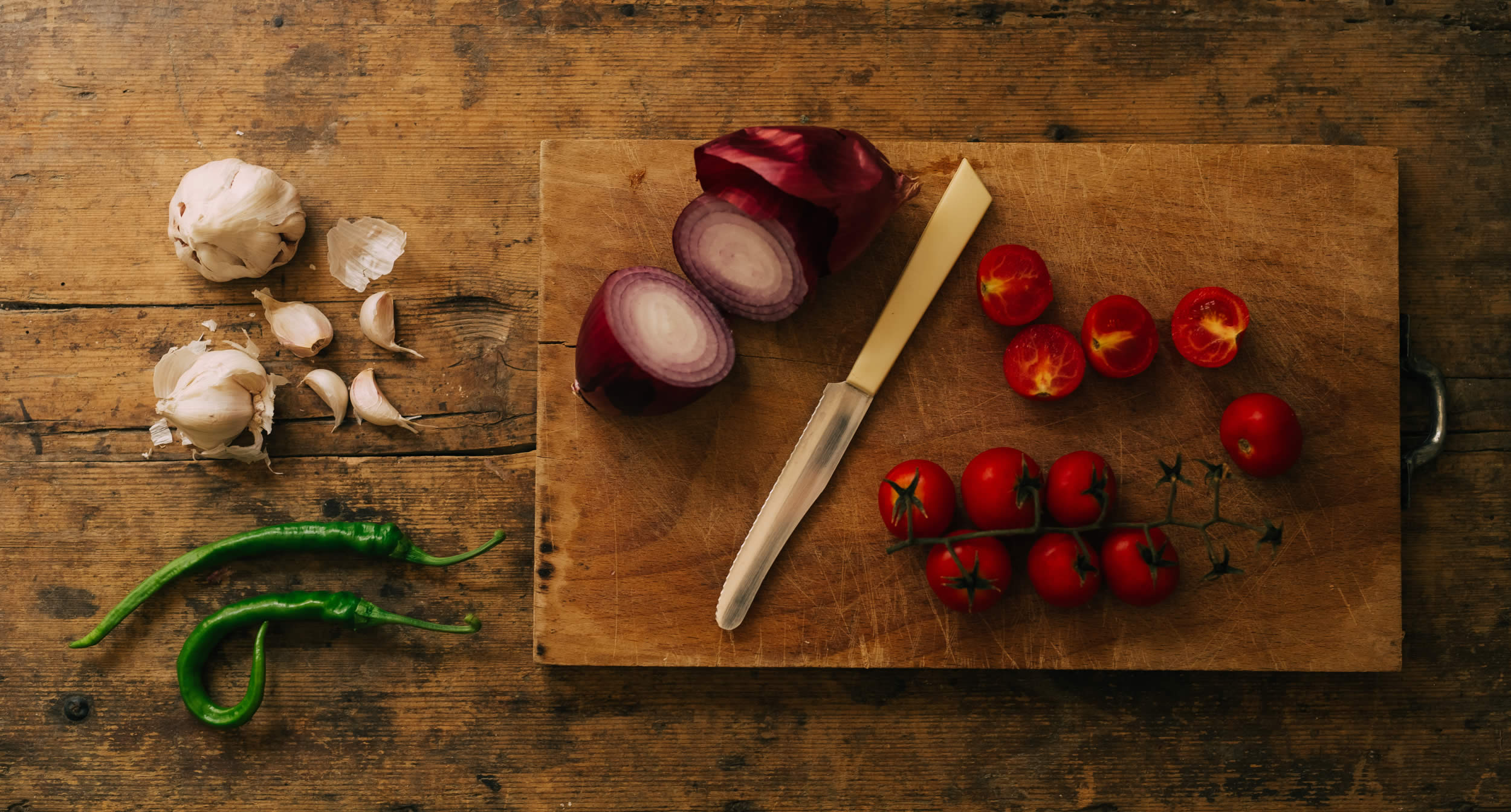 Fresh vegetables and herbs on a cutting board at L’Orto di Beppe